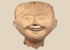 Pre-Columbian Veracruz Sonriente smiling face terracotta head with scroll-motif headdress, circa 600–900 CE