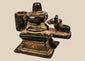Antique 19th century Indian brass Shiva Lingam and Nandi miniature devotional shrine with aged dark patina.