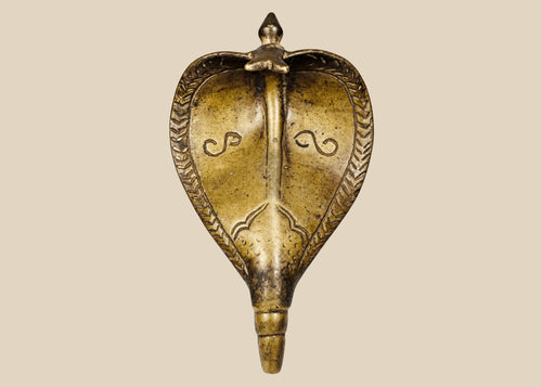 Antique 19th century Indian brass Naga cobra shrine canopy with expanded hood and aged patina.