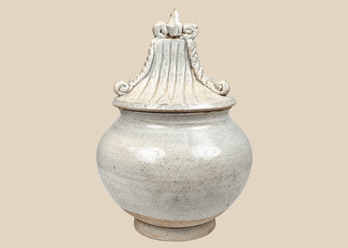 Antique Thai Sawankhalok covered stoneware jar with pale crackled glaze and sculptural architectural lid, 15th–16th century.