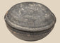 Ancient Chinese gray pottery covered bowl attributed to the Tang Dynasty, shown closed with shallow domed lid and aged earthenware surface.