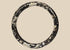 Ancient Roman dark glass bracelet with heavy iridescent burial weathering, circa 2nd–4th century CE