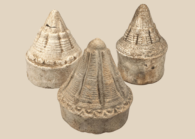 Three Eastern Indian Buddhist terracotta votive stupas with tiered conical forms, circa 8th–12th century CE