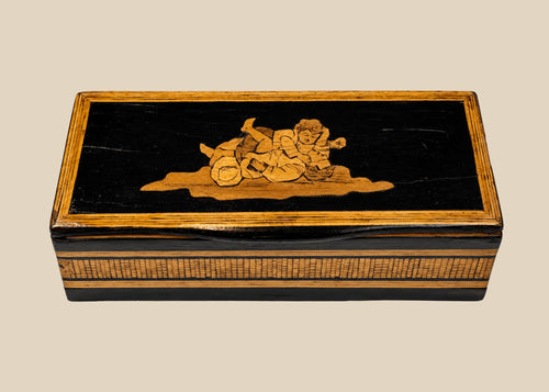 Anglo-Indian black lacquered marquetry trinket box with reclining figural inlay on lid, front view
