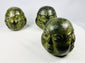 Trio of Buddhist devotional heads crafted in traditional style with aged patina finish