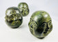 Buddhist devotional head figures housed in decorative brocade presentation box