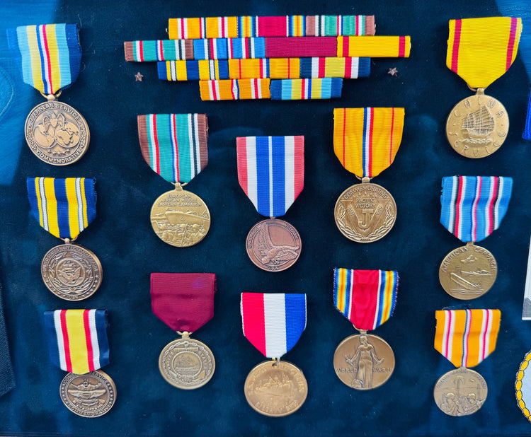 Vintage American naval service shadow box with embroidered patches and commemorative decorations