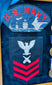 U.S. Navy military memorabilia display with USS Norris DD-859 insignia and service medals