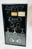 Framed display of antique handcuffs, shackles, and restraint devices from the 19th–20th century, mounted in a glass shadow box with plaques and keys.