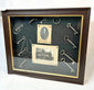 19th-century framed display with antique iron keys and portrait
