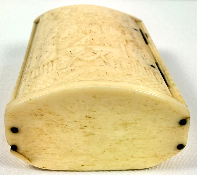 Napoleonic-era bone snuff box displaying ornamental rope-pattern borders and finely carved decorative details.