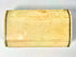 Early 19th-century bone snuff box with warm polished patina, natural discoloration, and intricate Masonic symbolism.