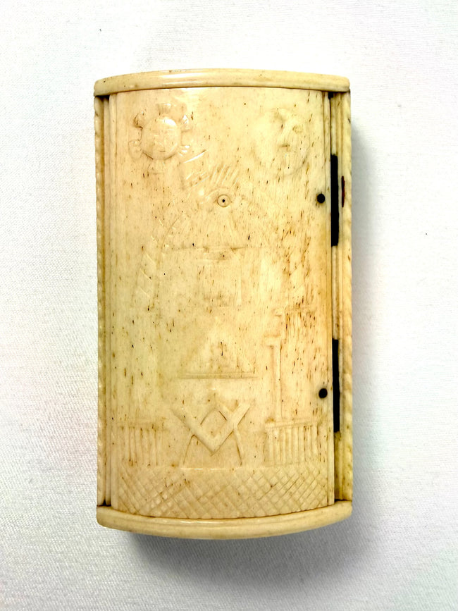 Hand-carved bone snuff box decorated with the Masonic Square and Compasses, All-Seeing Eye, and celestial symbols.