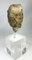 Museum-quality Gandharan Buddha head fragment with weathered stone surface and serene expression
