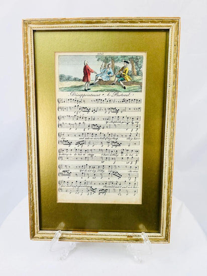 Georgian era 18th-century engraved sheet music with hand-colored pastoral scene, depicting figures in a countryside setting above musical notation; mounted in a gilt frame with velvet backing, showcasing fine period engraving, early music history, and decorative art appeal.