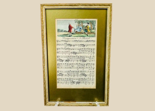 Georgian era 18th-century engraved sheet music with hand-colored pastoral scene, depicting figures in a countryside setting above musical notation; mounted in a gilt frame with velvet backing, showcasing fine period engraving, early music history, and decorative art appeal.