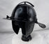 Historic Northern European cavalry helmet with pierced ear guards, adjustable nasal bar, and aged black finish.