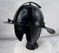 Historic Northern European cavalry helmet with pierced ear guards, adjustable nasal bar, and aged black finish.