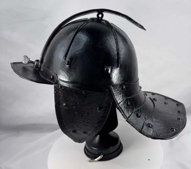 Antique European military helmet from the Thirty Years' War era with articulated neck guard and forged iron construction.