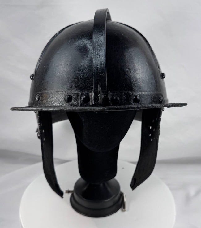 Seventeenth-century German or Dutch forged iron helmet featuring radiating flutes and original ring finial.