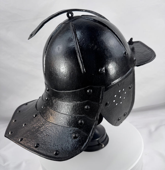 Forged iron German or Dutch military helmet dating to circa 1630–1670 with preserved original black paint.