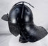 Museum-quality seventeenth-century European armour helmet with fluted skull and original wing-form nasal adjustment screw.