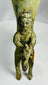 Decorative antique bronze rhyton with oxidized surface and mythic figure