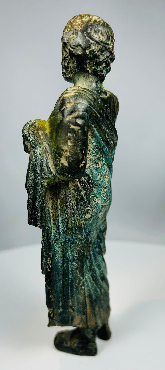 Small bronze statue inspired by Greco-Roman philosopher with natural oxidation