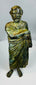 Antique bronze male statue with classical toga and rich green surface patina