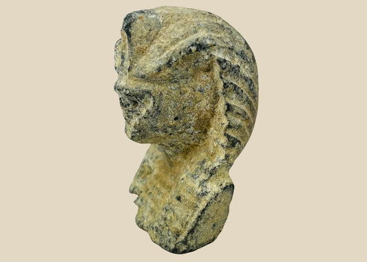 Carved limestone pharaoh head with nemes headdress and uraeus cobra motif, European Grand Tour collectible circa 1800–1920 on neutral background.