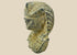 Carved limestone pharaoh head with nemes headdress and uraeus cobra motif, European Grand Tour collectible circa 1800–1920 on neutral background.