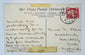 Reverse of an early 20th-century Egypt postcard with handwritten correspondence, Egyptian postage stamp, and Cairo postal cancellation.