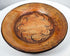 Side perspective of ancient Greater Nicoya pottery plate showing broad shallow form and raised rim
