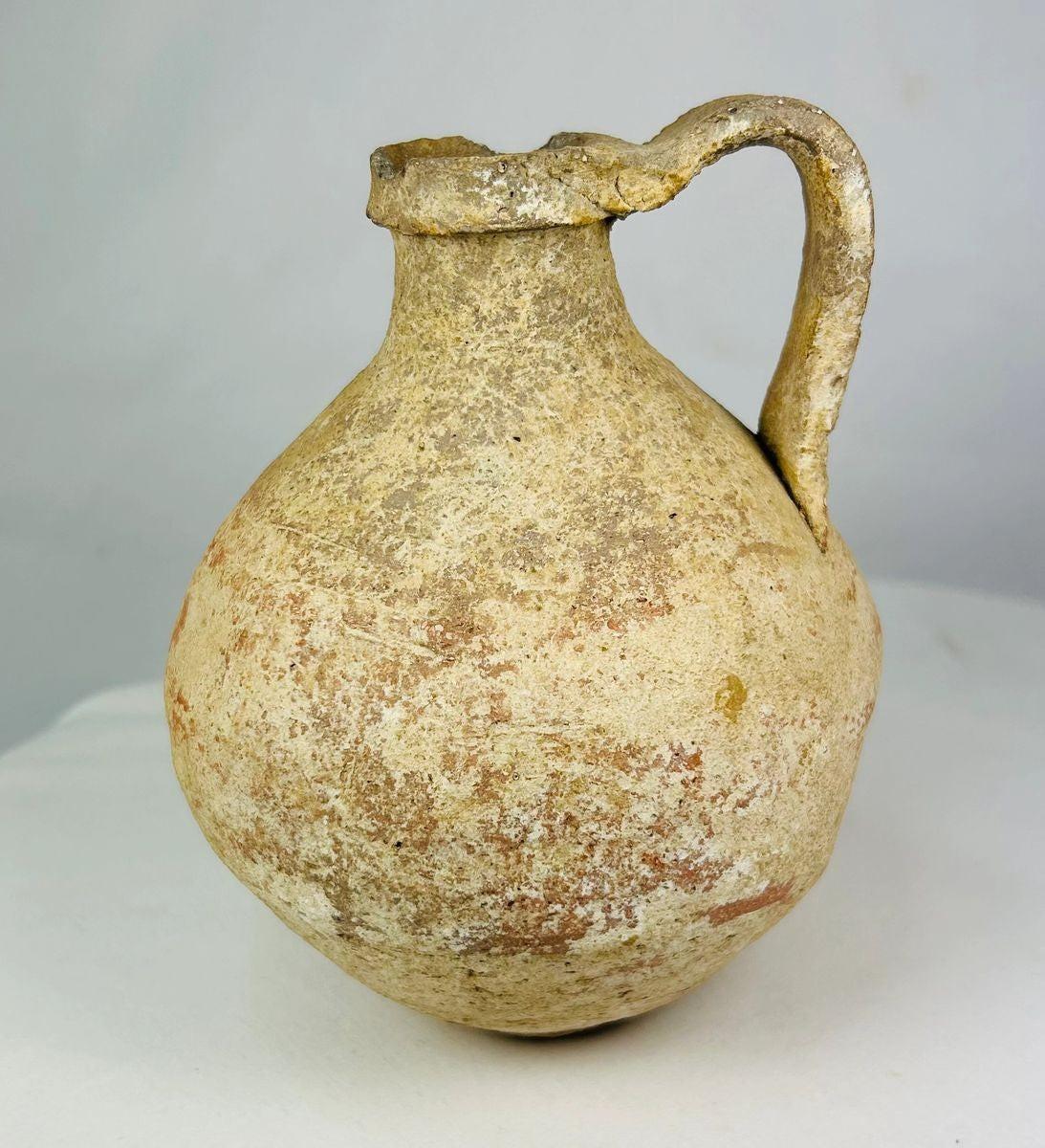 Ancient Abydos terracotta jug from Egypt with rounded body, spouted rim, and arched handle, Greco-Roman period, circa 1st century BCE–3rd century CE.