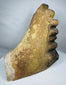 Antique architectural ceramic ornament with classical Greek influences, displaying a sculpted face and richly weathered terracotta surface.