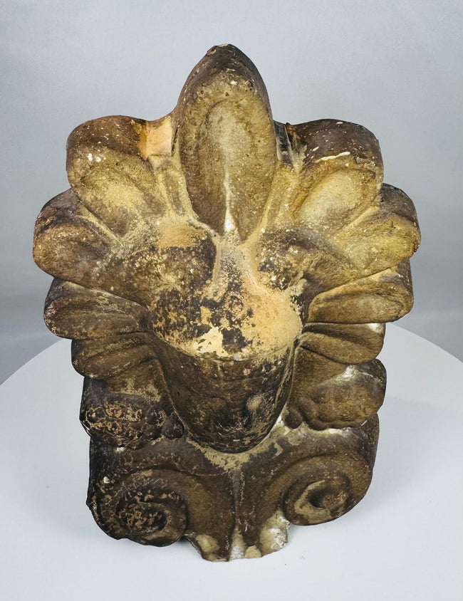 Authentic Greek architectural antefix in fired clay with weathered surface, classical styling, and decorative scroll elements.