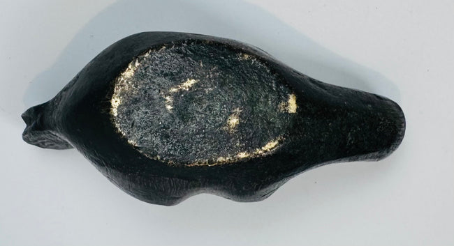Figural satyr-form oil lamp with sculptural facial details, dark patina, and traditional oil lamp construction.
