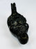 Nineteenth-century European oil lamp in the form of a grotesque mask influenced by classical and Renaissance traditions.