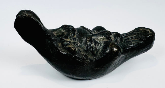 European decorative oil lamp showcasing a grotesque mask design inspired by classical mythology.