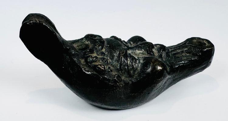 European decorative oil lamp showcasing a grotesque mask design inspired by classical mythology.