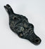 European figural oil lamp depicting a stylized satyr mask with pronounced facial features and beard.