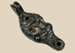 Antique grotesque satyr-form oil lamp with cast metal construction and dark aged patina, Europe, 19th century.
