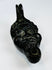 Nineteenth-century European oil lamp in the form of a grotesque mask influenced by classical and Renaissance traditions.