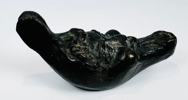 European decorative oil lamp showcasing a grotesque mask design inspired by classical mythology.
