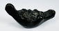 European decorative oil lamp showcasing a grotesque mask design inspired by classical mythology.