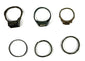 Top and front views of six ancient bronze finger rings with decorative bezels and simple bands, circa 3rd–7th century CE