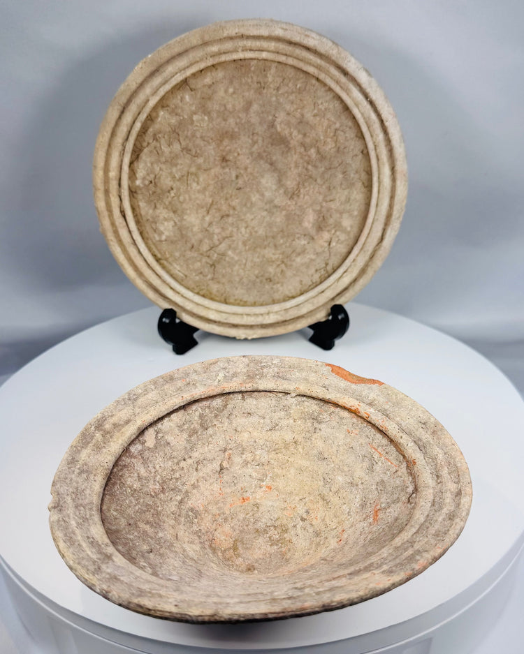 Ancient Roman terracotta serving bowls from Tunisia featuring shallow forms, concentric molded rims, and archaeological patina.