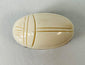 Late 19th to early 20th century East Asian bone scarab carving displayed on stand