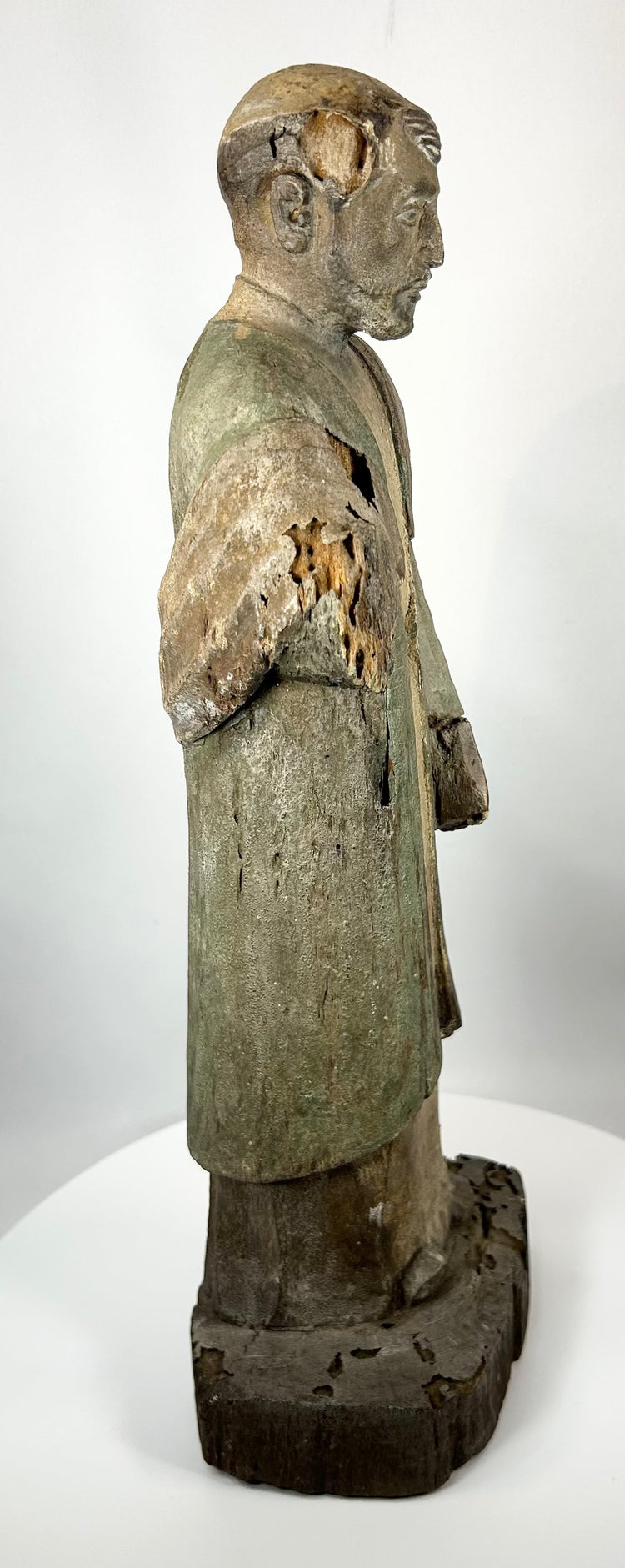 Antique carved saint figure from Latin America with devotional character