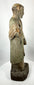 Antique carved saint figure from Latin America with devotional character